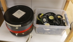 A collection of cinema projectionist's film reels, trailers for films, etc. titles including Notting Hill, Grand Tour, Braindead, etc. in plastic and metal canisters